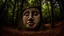 Placeholder: large stone carving of a face in the forest