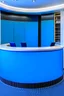 Placeholder: A circular blue reception desk with three chairs