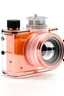 Placeholder: transparent orange and brown photo camera with a pastel pink teleobjectiv lenses