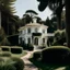 Placeholder: A delicate image of a classic white villa in the middle of a landscaped garden and tall trees