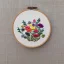 Placeholder: exquisite whimsical australian flowers in embroidery hoop, intricate, highly detailed, linen and wood backdrop