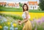 Placeholder: Young woman in flower field in country side ,river, houses