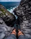 Placeholder: from the point of view of a rock climber, look down at the ocean rocks below as you climb high into the bluffs of ireland. holding on to the cliff face, the ocean below storms and swirls around a giant whirlpool