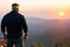 Placeholder: a brawny man with grey hair views sunset from a cliff