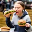 Placeholder: Greta Thunberg eating human burgers oozing with grease.