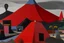 Placeholder: A grayish red pyroclastic volcano painted by Stuart Davis