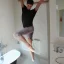 Placeholder: He enjoys practicing his ballet in the bathroom.