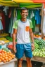 Placeholder: A fruit and vegetable seller wearing shorts and a summer T-shirt invites people to his shop with a smile