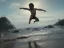 Placeholder: children jumping in water on a beach capture them against the sun and make an art silhouette, hyper details, real sharp, 8k, well detailed, well shaped