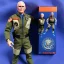 Placeholder: Mike Pence G.I. Joe toy Doll space force uniform, orange blue fabric, guns, wall packaging for sale, bright pricetag, empty box