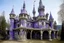 Placeholder: A purple haunted castle filled with ghosts painted by Antoni Gaudi