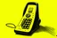 Placeholder: cartoon-looking vintage hand-held phone overlaid with a yellow background.