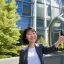 Placeholder: A short haired, Japanese female software engineer from MIT taking a selfie in front of Building 92 at Microsoft in Redmond, Washington