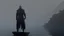 Placeholder: black robed monk in a small boat on quiet water in the mist