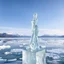 Placeholder: in a frozen sea with pretty mountains a full lady ice statue in artist pose standing over a ice block looking at camera, of clear glass like ice that going to melt and water drops fall from all body.