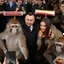 Placeholder: DARK HAIR politician of poland TAKING A PHOTO WITH MONKEYS, MUSHROOMS IN THE BACK monkeys monkeys