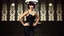 Placeholder: Louise Brooks, dressed in stockings and stilettos, with a black bob hairstyle with bangs and dark sultry eyes and red lips, standing with hands on hips, smiling in a 1920s background
