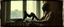 Placeholder: STYLE: gritty 19th-century gothic photography, Zdzisław Beksiński surrealism, Caravaggio chiaroscuro, tactile analog grain, pinhole-camera softness, heavy vignetting, scratched emulsion, rugged irregular photo border. SCENE: alien cowboy, folding black socks beside a window in an old apartment, r, completely absorbed in the mundane task.