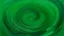 Placeholder: Abstract painting of a placid, emerald green body of water. Ripples and concentric circles, light and airy, are dispersed across the surface, in shades of lighter and darker green. Subtle variations in hue and tone create the effect of depth and movement on the water. Slight, indistinct traces of light brownish-orange elements are dispersed across the surface. A minimalist, almost meditative, mood pervades the piece. Soft, diffused lighting, a muted palette, and the smooth, almost painterl