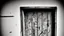 Placeholder: unhinged door, anime, monochrome, black background, ink, simple, maximum quality, broken hinge, barely functioning, why is it still being used it's a health hazard, centered on frame, far