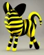 Placeholder: A black, round creature with long ears with yellow stripes and a long tail with a yellow stripe