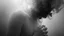 Placeholder: surreal vibe, grayscale, black and white, a caracter dissolving into shadows and fog, body torn into shards of light and darkness. A haunting, dreamlike composition that captures isolation, inner demons, struggle of anxiety. surreal, fog, shadows, atmospheric