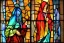 Placeholder: Cloaked woman holding fire on stain glass window