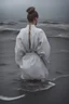 Placeholder: Standing in the grey-north sea with white clothes. Girl with a bun. Rains heavily.