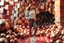 Placeholder: beautiful lady with todays modern clothing and sport shoes, in surreal stage made of fractal random size spheres with helical strip colors in clothing similar to environment full body posing to camera,animating background metallic random color cubes