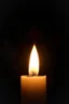 Placeholder: Close-up of the candle flame that glows unnaturally bright, mysterious aura, soft, a devil face in distance in the background