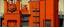 Placeholder: An orange colored ferro factory with gears painted by Piet Mondrian