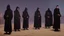 Placeholder: black robe hooded monks in the chapel