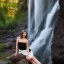 Placeholder: a seductive woman wearing a short dress posing by a waterfall