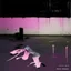 Placeholder: Minimal abstract oil paintings of a desolate 1960s carpark. Illuminated by a spotlights. On the floor are concrete fragments and road markings . In the dark mysterious style of Justin Mortimer and Francis Bacon.