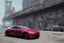 Placeholder: A Tesla 'Model S' is parked, near the 'Pier 11' in Manhattan. (CINEMATIC, WIDE ANGLE LENS, PHOTO REAL)