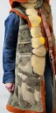 Placeholder: Young fleshy woman. thick thighs, average body type. Mantle is sewed of recycled Denim and sewed together of camouflage pieces. Camouflage colors are orange,terracotta, cream and purple. Cream latex gaiter. More yellow(Munsell)!!!Big bright purple/khaki felt tippet and cream or blue or lilac colored-hood. mantle is merged with satchel. . AKG-style headphones (gold rings!) is merged with small felt cap with small visor. Style: Haute Couture in 1936, Paris fashion in 2023.