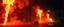 Placeholder: plasma vampire flickers like hypnotic fire in geometric shapes, like a strong will-o-wisp in A cavernous industrial warehouse becomes a fever-dream carnival of fire and smoke, lit exclusively by erratic strobes and the orange glow of unpredictable blazes. The world is drenched in soot, haze, and manic energy — walls drip with condensation, fire extinguishers become absurd props, and every surface reflects the flicker of flames being born and killed in seconds. The visual journey spirals from con