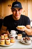 Placeholder: a young dirty mechanic man enjoying high tea by himshelf with little cakes
