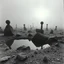 Placeholder: A striking quality close-up Ilford photograph captures a surreal wasteland with odd stones, pond, odd spindle-shaped objects, spooky, creepy, details of the dust very accentuated, glossy, organic, adorned with minerals and rocks, fog. Bathed in feeble light, eerie, James Ensor style, black sun, fog, volumetric light, octane render