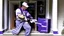 Placeholder: fedex driver with a chainsaw at the front door