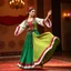 Placeholder: A graceful Azerbaijani traditional dance performance. A female dancer wearing a colorful Azerbaijani national costume with a long flowing skirt, embroidered vest, and traditional headpiece. She performs elegant Caucasian dance movements with delicate hand gestures and smooth spinning steps. The scene is on a traditional stage with warm lighting, Persian carpet patterns, and subtle Azerbaijani cultural decorations. The music atmosphere feels lively and folkloric. Cinematic lighting, high detail,