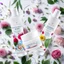 Placeholder: a bottle for cosmetics and a cream jar lies on a beautiful floral background top view, in the background there are beautiful spring flowers and a drop of cream, high-quality picture, top view