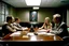 Placeholder: Reunión de 4 personas en una mesa de reuniones en una oficina. Fotografía en color. Con cámara Leica 35 mm