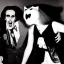 Placeholder: Photo of 1980s party with a vampire scaring a cat