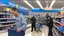 Placeholder: suspicious man buys cellphone at walmart