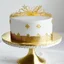 Placeholder: A picture of a simple white cake with golden decoration