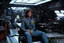 Placeholder: a typical scene in the main room of the Nostromo: Ellen Ripley sits in her worker outfit