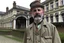 Placeholder: ww1 doctor talking close-up standing up looking to the camera, ww1 mansion infirmary background