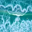 Placeholder: Create an image of a large, vibrant green wave in the ocean with intricate patterns formed by foam. Include multiple surfers riding the wave, capturing the dynamic movement of water and the excitement of surfing.