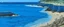 Placeholder: A blue beach near a coral cove painted by John Brack